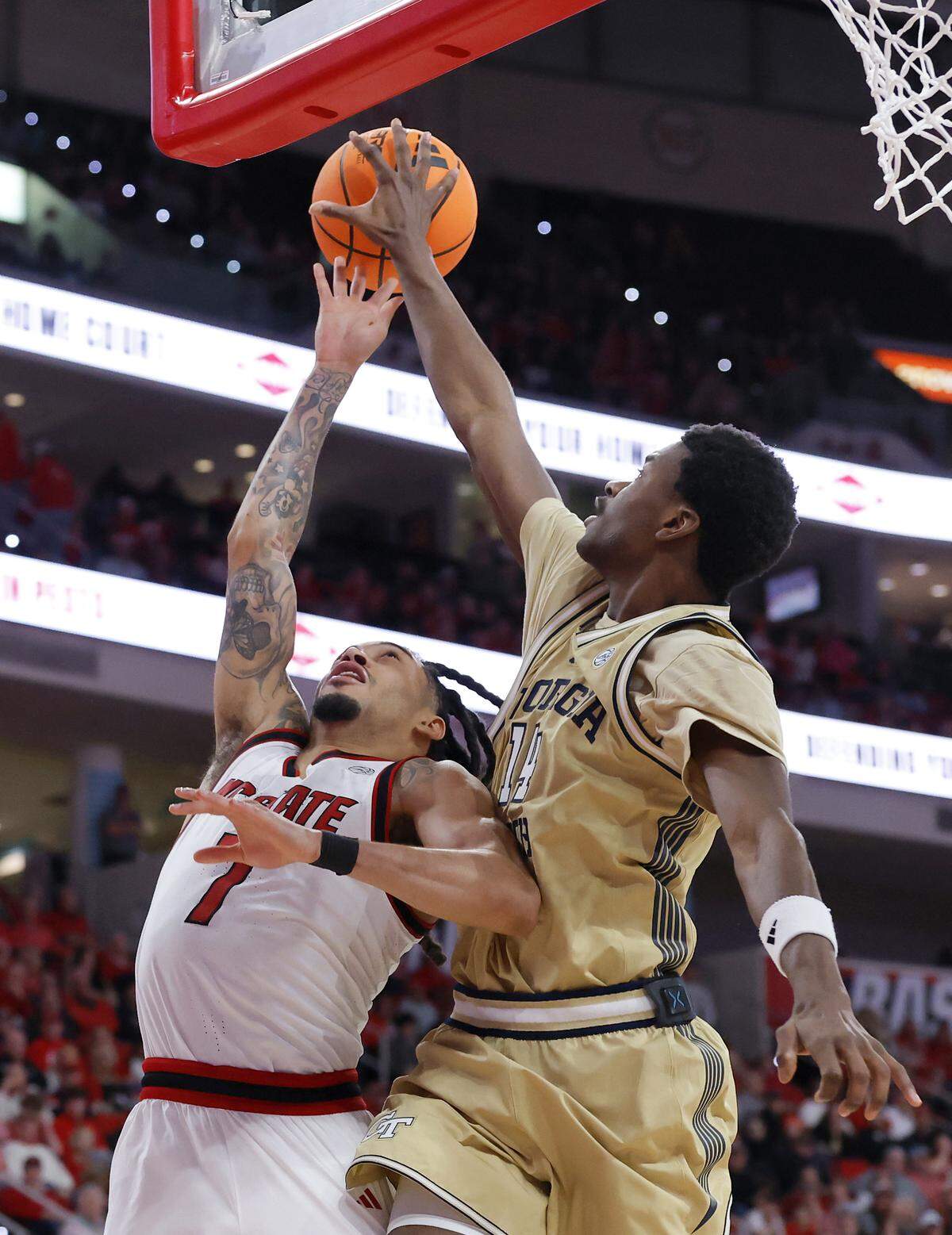 Georgia Tech’s Kowacie Reeves Jr. blocks a shot by N.C. State’s Alyn Breed during the second half of the Wolfpack’s 78-74 loss on Saturday, Jan. 17, 2026, at Lenovo Center in Raleigh, N.C. 
