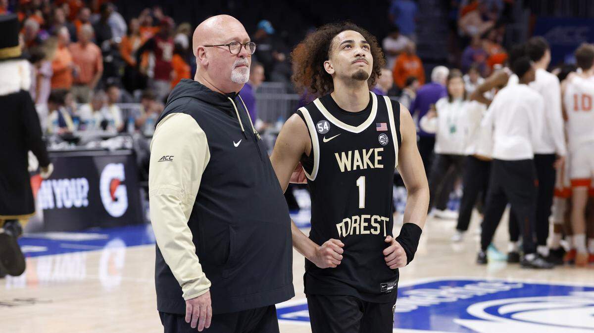 Wake Forest head coach Steve Forbes walks off the floor with Nate Calmese (1) after Clemson’s 71-62 victory over Wake Forest in the second round of the 2026 ACC Men’s Basketball Tournament at the Spectrum Center in Charlotte, N.C., Wednesday, March 11, 2026.