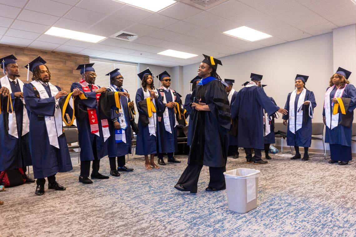 St. Augustine’s University graduates get ready to take part in a commencement ceremony at Wake Chapel Church in Raleigh on Friday, Dec. 13, 2024.