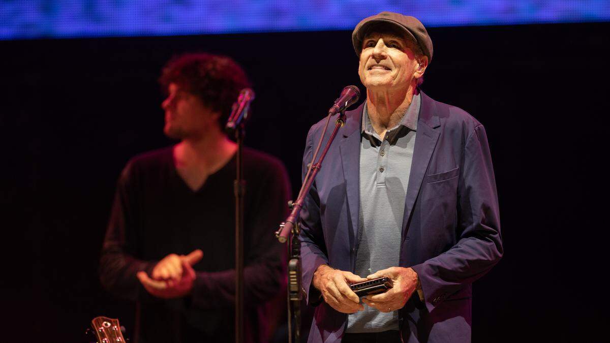 James Taylor admires the crowd on the hill during his concert in Raleigh, N.C., Thursday night, Sept. 4, 2025.