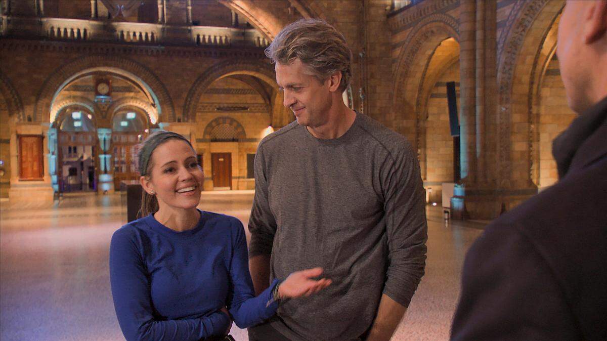 “We’re Back!” – THE AMAZING RACE begins its historic 33rd trip around the world when 11 new teams take off from their homes and travel to their first destination, London, England, on the special two-hour season premiere of THE AMAZING RACE, Wednesday, Jan. 5 (8:00-10:00 PM, ET/PT) on the CBS Television Network, and available to stream live and on demand on Paramount+*. The historic season began filming in February 2020, but after three legs was forced to halt production due to the COVID-19 pandemic. Over one and a half years later and the longest pitstop in the show’s history, THE AMAZING RACE resumed and concluded production this fall. Phil Keoghan is the host. Pictured L-R: Kim Holderness, Penn Holderness. Photo: Screengrabs/CBS ©2020 CBS Broadcasting, Inc. All Rights Reserved