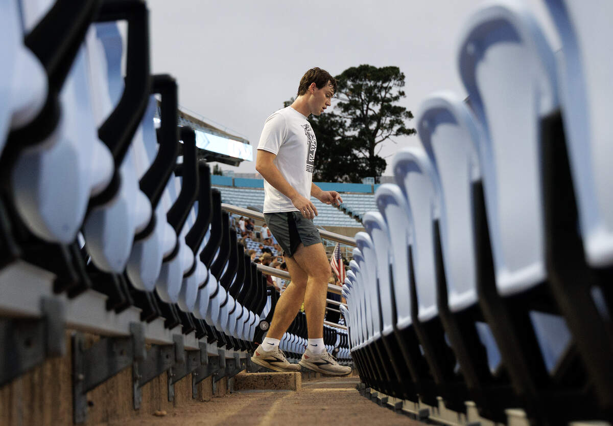 A person runs down the stairs during an event at Kenan Memorial Stadium on Thursday, Sept. 11, 2025, to honor those who lost their lives during the attacks of Sept. 11, 2001.