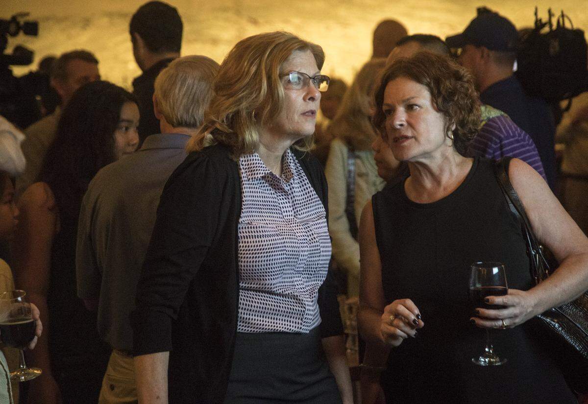 Raleigh mayor Nancy McFarlane, left, watches election returns while talking with four-term at large city counciler Mary Ann Baldwin, who did not seek reelection, Tuesday evening, Oct. 10, 2017 at Brewery Bhavana in downtown Raleigh.