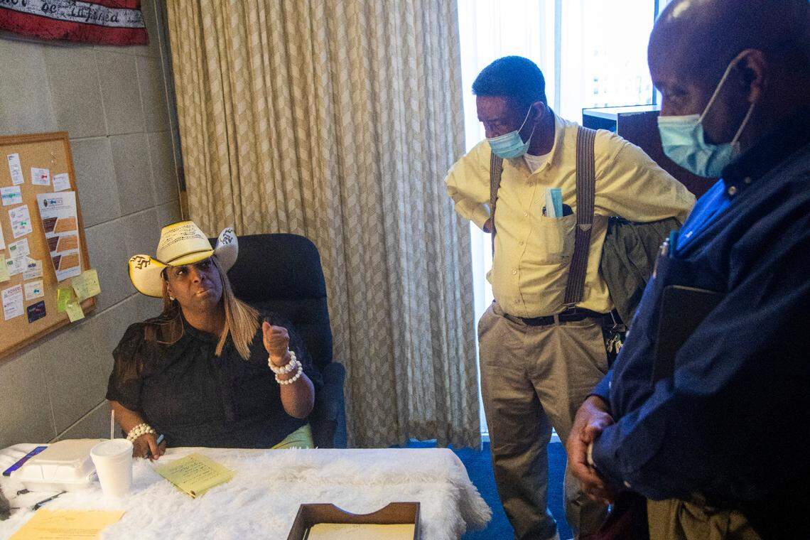 A group of Black farmers including Calvin Jones and Charles Jones, right, speak with state Rep. Kanika Brown Thursday, in her office at the North Carolina Legislative Building Thursday, Feb. 23, 2023. The farmers criticized the language of a proposed medical marijuana bill, which they say opens the door to corporate monopolization and shuts locals out.