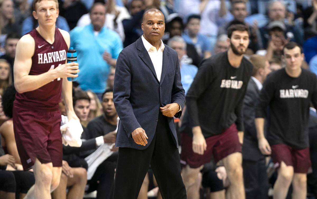 Harvard coach Tommy Amaker steps to the court after calling a time out during a game against North Carolina on Wednesday, January 2, 2019 at the Smith Center in Chapel Hill.