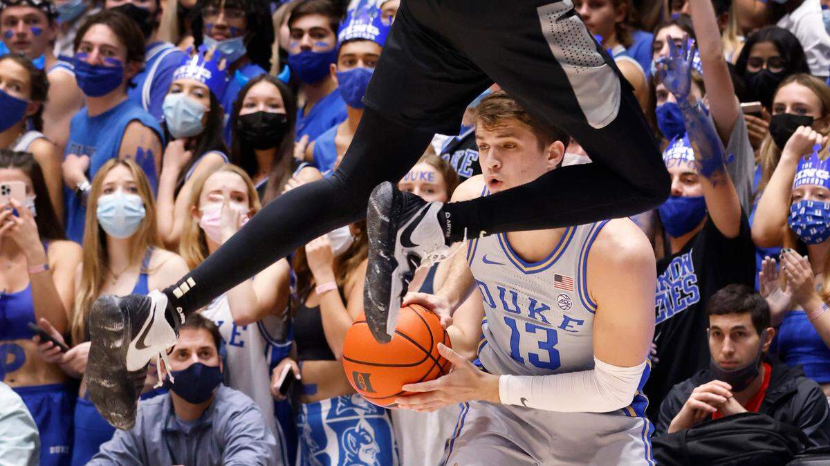 Duke’s Joey Baker keeps the ball as Army’s Isaiah Caldwell jumps to pressure him during Duke’s game against Army at Cameron Indoor Stadium in Durham, N.C., Friday, November 12, 2021.