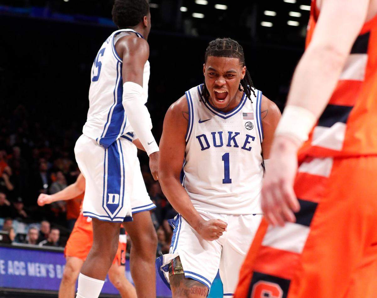 Dukeís Trevor Keels (1) and Mark Williams (15) celebrate in the final seconds of Dukeís 88-79 victory over Syracuse in the quarterfinals of the ACC menís basketball tournament at the Barclays Center in Brooklyn, N.Y., Thursday, March 10, 2022.