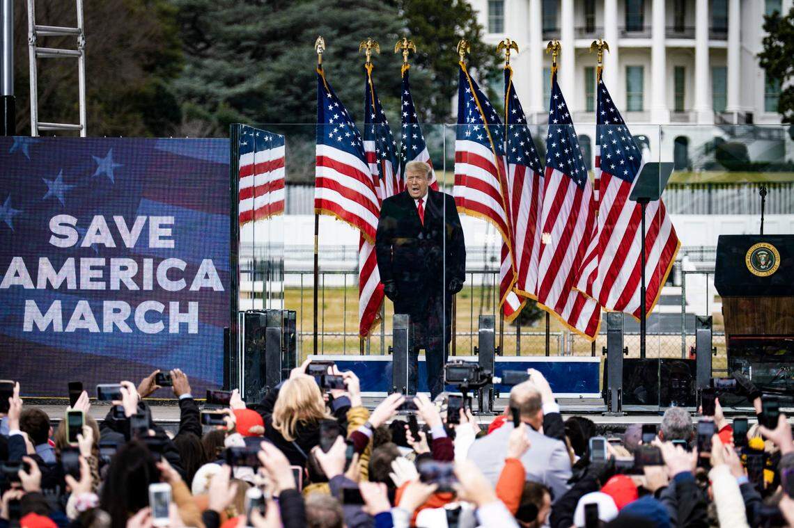 President Donald Trump delivers an incendiary speech from behind bullet-proof glass panels to thousands of supporters near the White House in Washington, Jan. 6, 2021. The Justice Department said on Thursday, Jan. 7, 2021, that it would not rule out pursuing charges against Trump for his possible role in inciting the mob that marched to the Capitol, overwhelmed officers and stormed the building a day earlier.