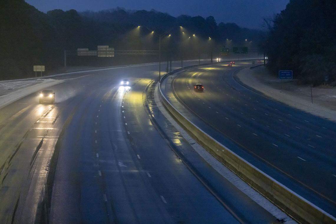 Traffic moves along I-40 at Rock Quarry Road just before sunrise on Monday January 26, 2026 in Raleigh, N.C. The main roads are mostly clear following a round of winter storms that moved through the area over the weekend. 