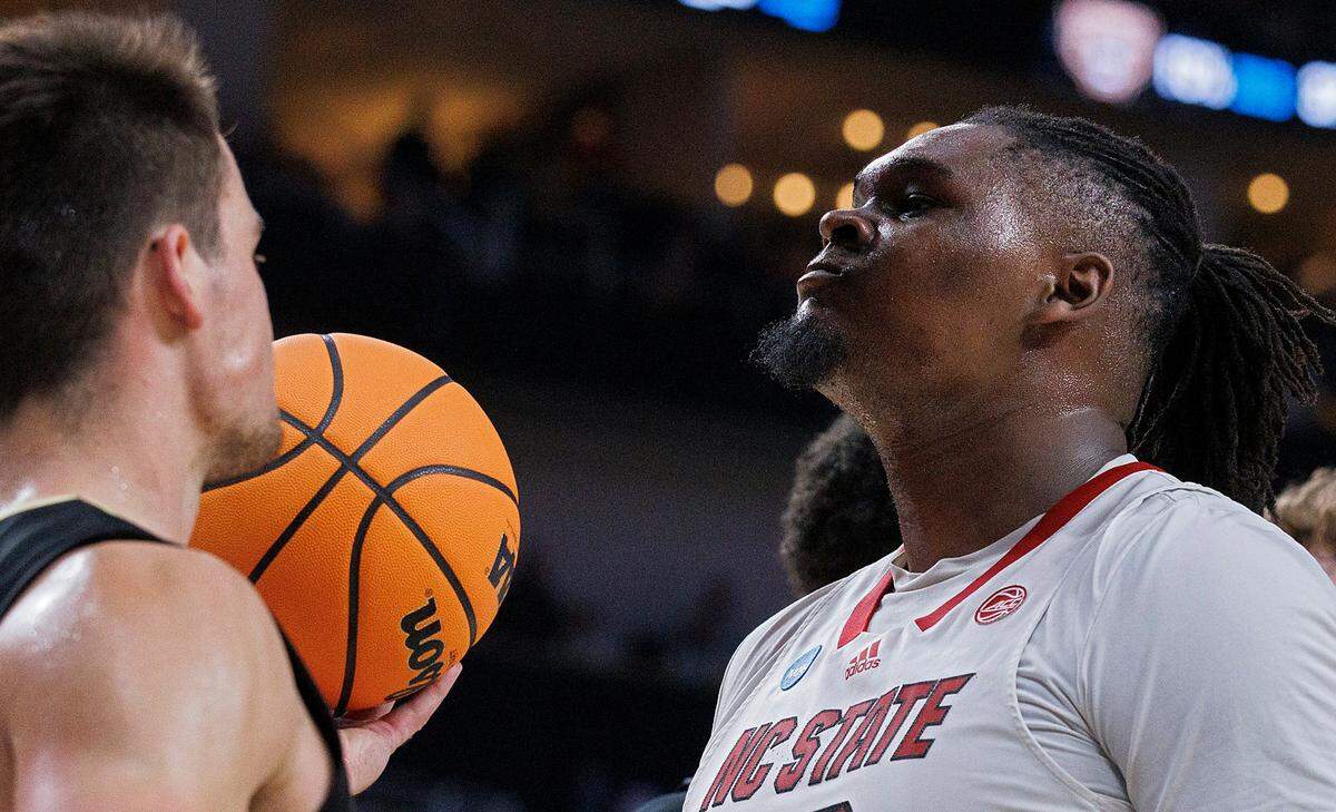N.C. State’s DJ Burns Jr. reacts after an and-one in the second half of the Wolfpack’s 79-73 overtime win against Oakland in the second round of the NCAA Tournament on Saturday, March 23, 2024, at PPG Paints Arena in Pittsburgh, Pa.