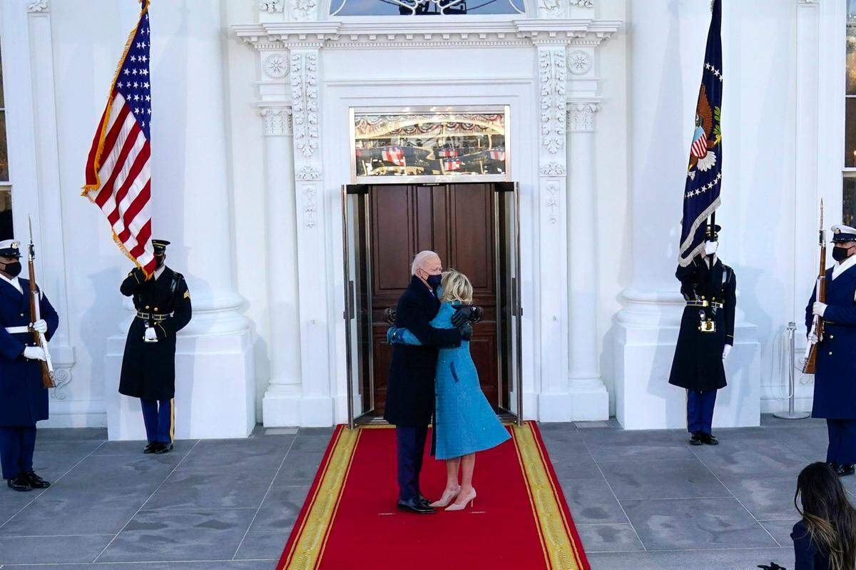 President Joe Biden and first lady Jill Biden hug as they arrive at the North Portico of the White House, Wednesday, Jan. 20, 2021, in Washington. (AP Photo/Alex Brandon, Pool)