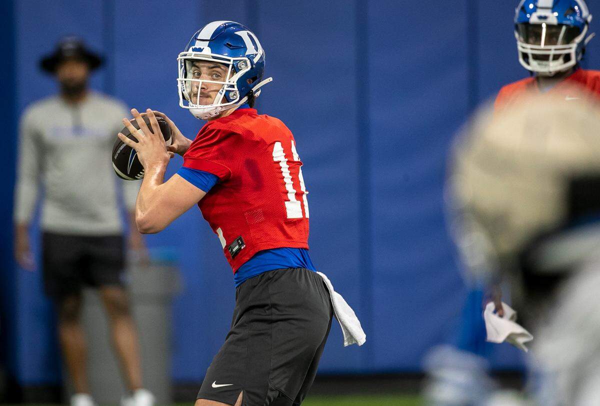 Duke quarterback Grayson Loftis (12) looks for a receiver during the Blue Devils’ spring practice on Friday, March 24, 2023 in Durham, N.C.