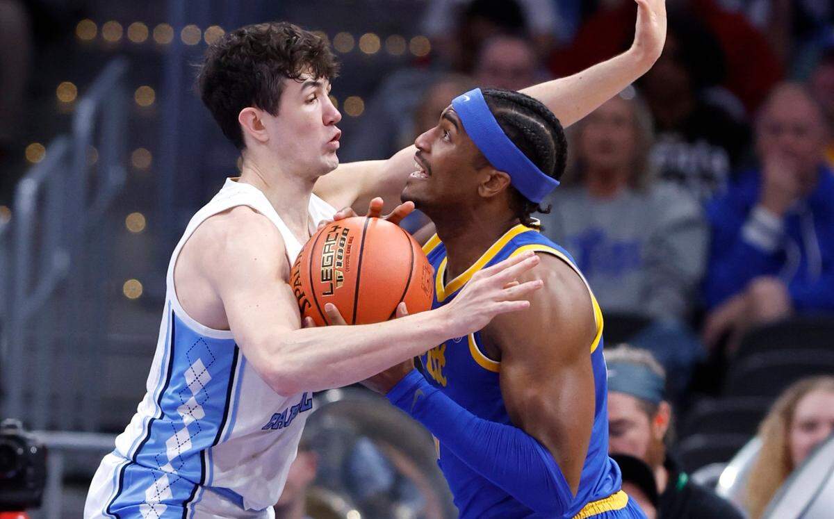 North Carolina’s Cormac Ryan (3) defends Pittsburgh’s Blake Hinson (2) during the first half of UNC’s game against Pitt in the semifinals of the 2024 ACC Men’s Basketball Tournament at Capital One Arena in Washington, D.C., Friday, March 15, 2024.