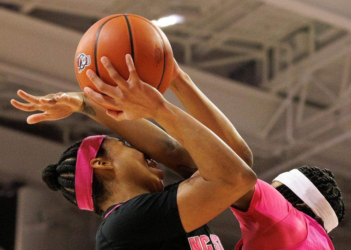 N.C. State’s Zoe Brooks is fouled by Louisville’s Nina Rickards during the second half of the Wolfpack’s 77-67 win on Monday, Feb. 5, 2024, at Reynolds Coliseum in Raleigh, N.C.