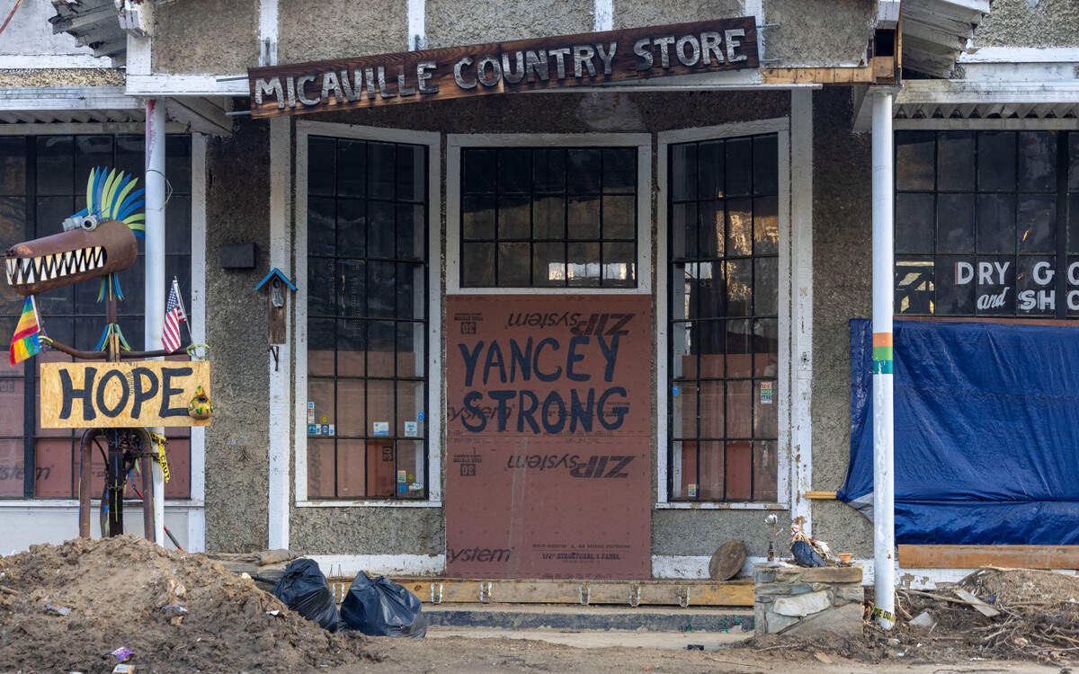 The Micaville Outpost, an old general store that was converted to an art gallery and museum, is boarded up after it was heavily damaged by flooding from Little Crabtree Creek in the wake of Hurricane Helene in September 2024.