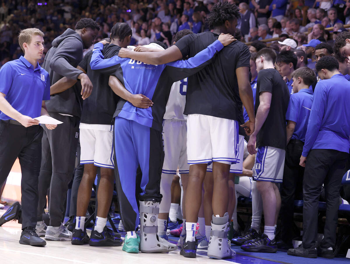 Duke’s Caleb Foster andPatrick Ngongba II (21) huddle with the team in the second half of Duke’s 76-61 victory over UNC at Cameron Indoor Stadium in Durham, N.C., Saturday, March 7, 2026.