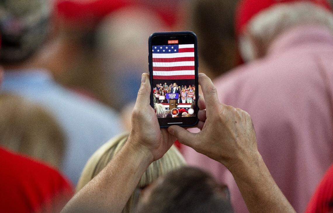 A rally attendee records remarks by Republican Vice Presidential candidate Senator J.D. Vance at Union Station on Wednesday, September 18, 2024 in Raleigh, N.C.
