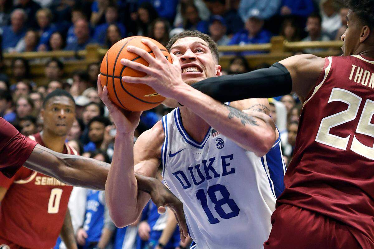 Duke’s Mason Gillis (18) is fouled as he heads to the basket during the first half of Duke’s game against Florida State at Cameron Indoor Stadium in Durham, N.C., Saturday, March 1, 2025.
