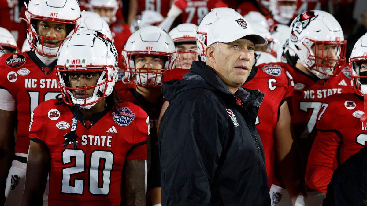 N.C. State head coach Dave Doeren prepares to lead his team onto the field before the Wolfpack’s game against ECU in the Military Bowl at Navy-Marine Corps Memorial Stadium in Annapolis, Md., Saturday, Dec. 28, 2024.
