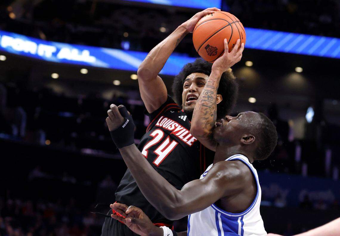 Louisville’s Chucky Hepburn (24) drives by Duke’s Khaman Maluach (9) during the first half of Duke’s game against Louisville in the finals of the 2025 ACC Men’s Basketball Tournament at the Spectrum Center in Charlotte, N.C., Saturday, March 15, 2025.
