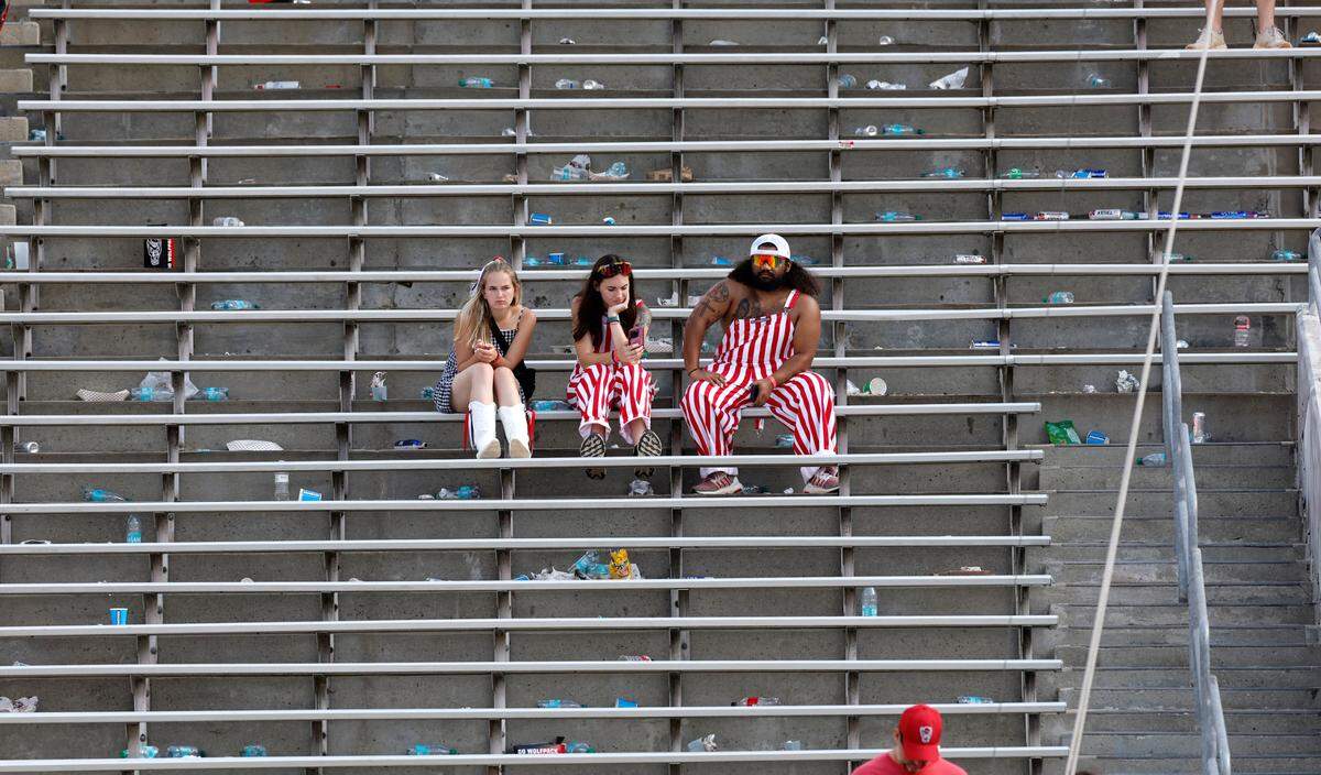 Wolfpack fans sit in the stands after Wake Forest’s 34-30 victory over N.C. State at Carter-Finley Stadium in Raleigh, N.C., Saturday, Oct. 5, 2024.