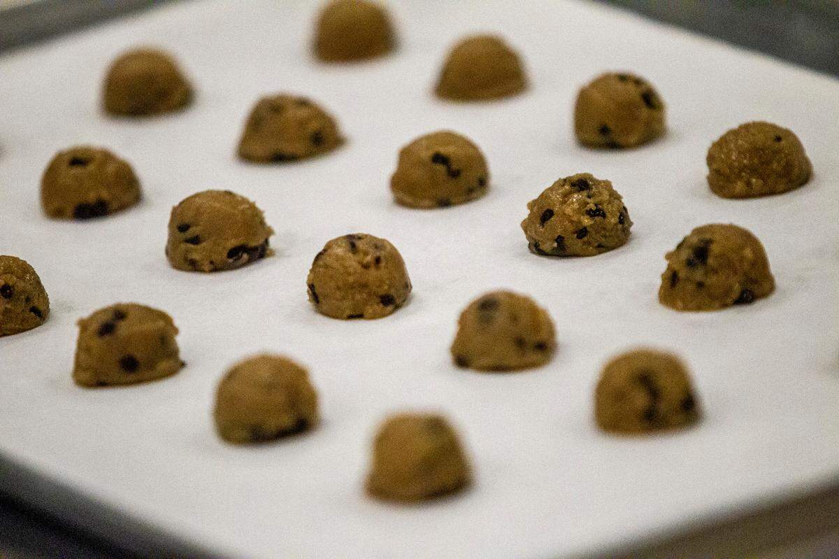 Cookie dough sits on a tray before being baked at Without A Trace Foods in Raleigh Tuesday, Dec. 15, 2020. The startup makes allergy-free snacks.