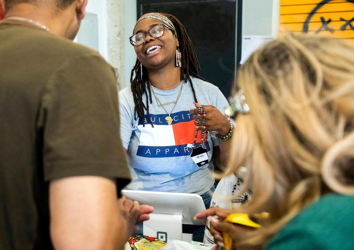 Kayla Walker rings up customers at the Black Friday Market, which opened the storefront downtown in December 2019 to sell products and art from small, mostly Black-owned businesses, on Wednesday, Aug 4, 2021, in Raleigh, N.C.