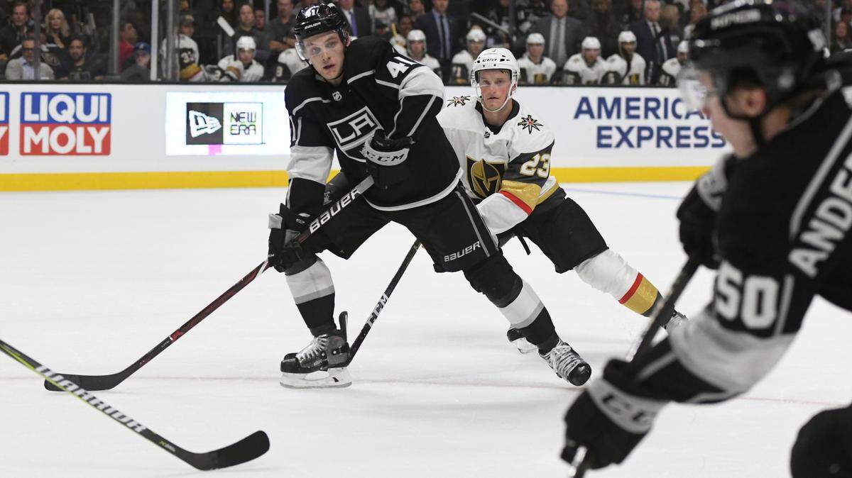 Los Angeles Kings right wing Sheldon Rempal, left, skates toward the goal as center Jaret Anderson-Dolan shoots against the Vegas Golden Knights during a preseason NHL hockey game, Thursday, Sept. 20, 2018, in Los Angeles. (AP Photo/Michael Owen Baker)