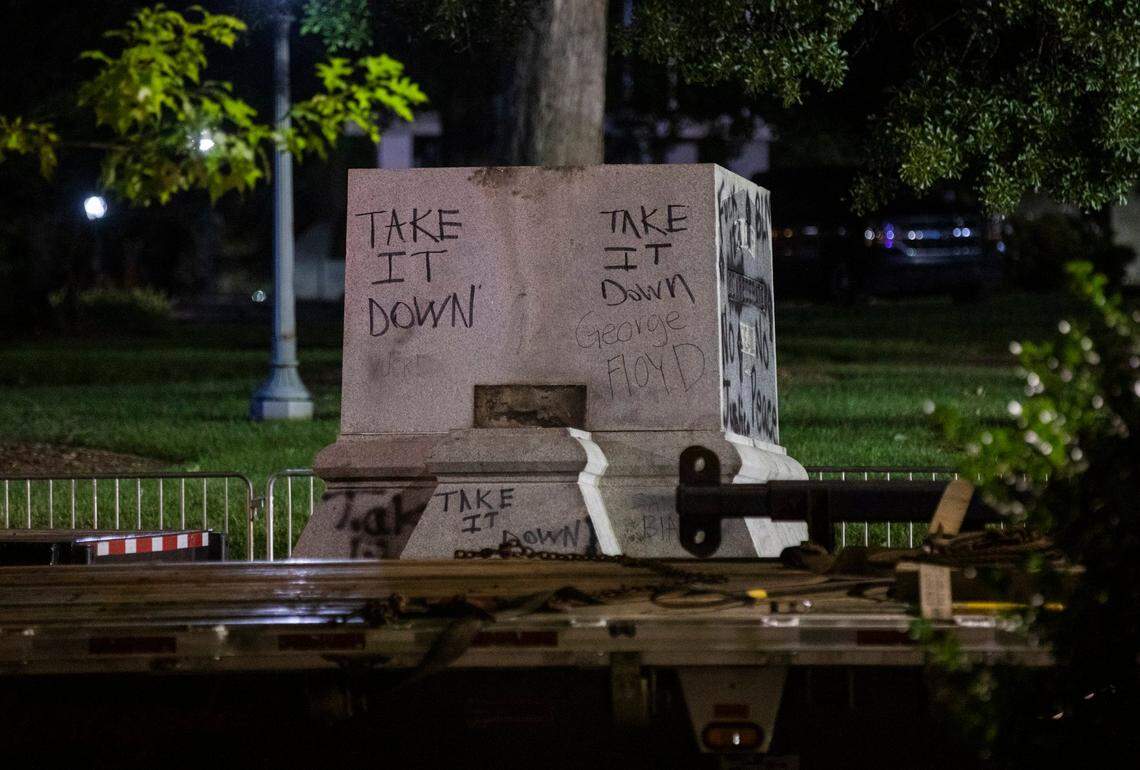 The final section of the 75-foot Confederate monument on the North Carolina Capitol grounds was lowered onto a trailer by a crane operator in the process to complete its removal after it stood for 125 years honoring the “bravery of the Southern soldier” in the Civil War, on Wednesday night, Jun. 23, 2020, in Raleigh, N.C. Gov. Roy Cooper ordered its removal, along with two other Confederate monuments, the day after protesters pulled down two bronze soldiers that stood midway on the monumentÕs base and law enforcement officers were injured.