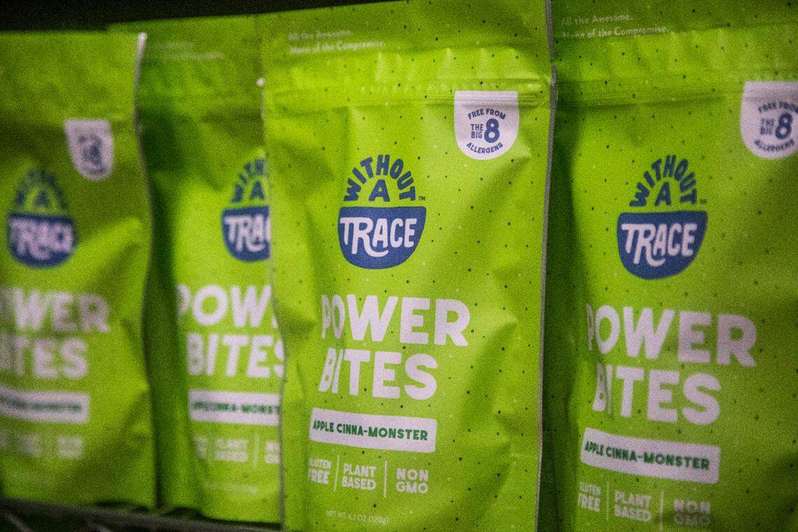 Packaged snacks sit on a shelf at Without A Trace Foods in Raleigh Tuesday, Dec. 15, 2020. The startup makes allergy-free snacks.