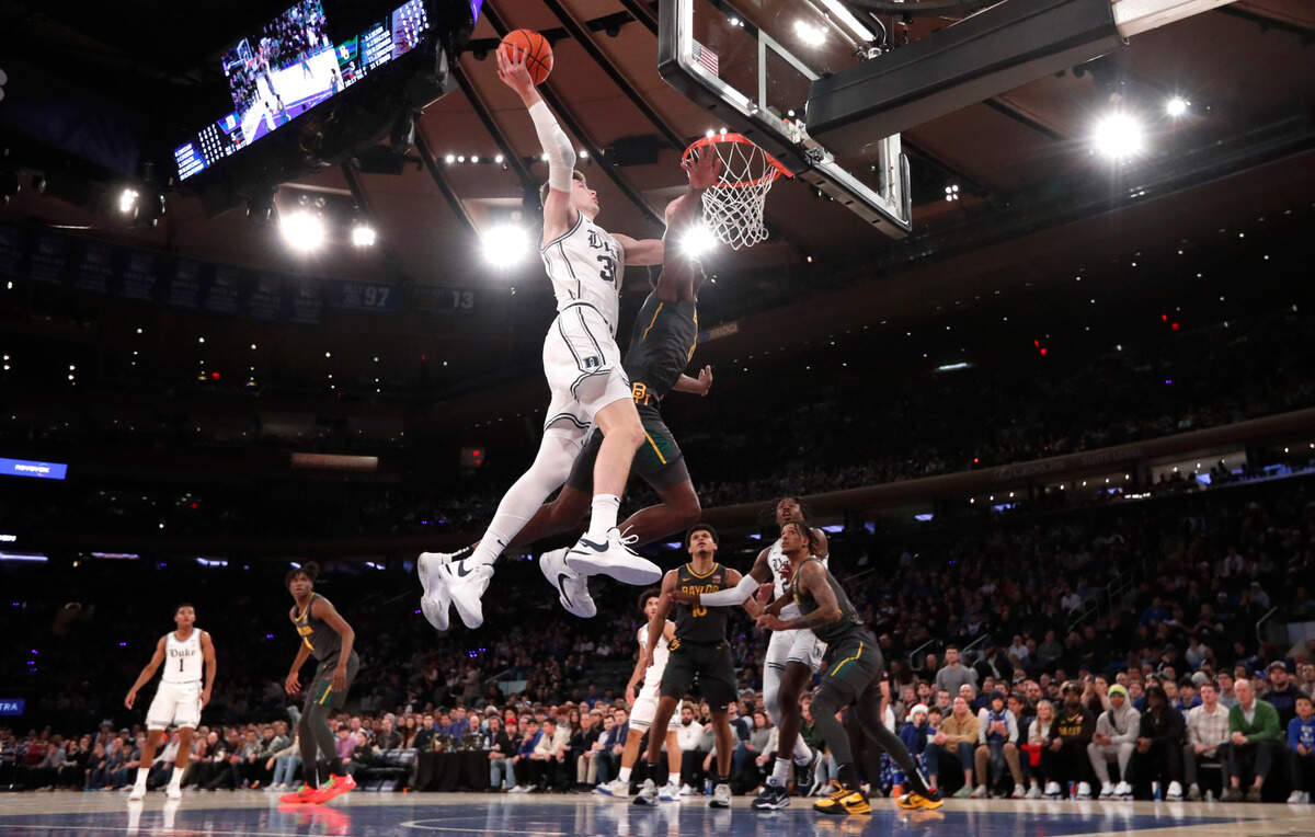 Duke’s Kyle Filipowski (30) heads to the basket as Baylor’s Yves Missi (21) defends during Duke’s 78-70 victory over Baylor at Madison Square Garden in New York City Wednesday, Dec. 20, 2023.