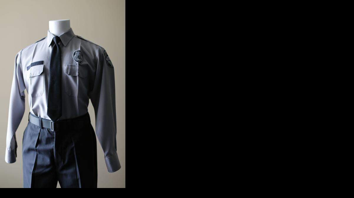 The State Correctional Officer uniform displayed on a mannequin shows the new gray-and-black color scheme.
