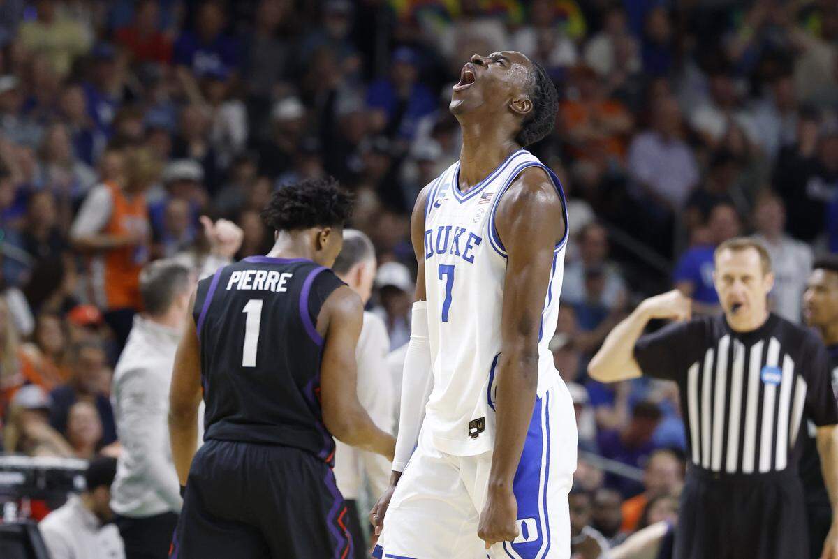 Duke’s Dame Sarr (7) celebrates making a three-pointer in the second half of Duke’s 81-58 victory over TCU in the second round of the NCAA Men’s Basketball Tournament at  Bon Secours Wellness Arena in Greenville, S.C., Saturday, March 21, 2026.