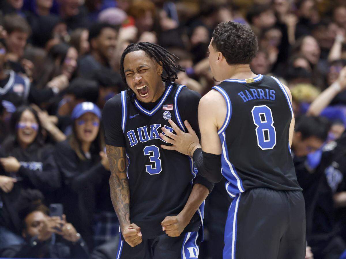 Duke’s Isaiah Evans and Darren Harris celebrate in the closing seconds of the Blue Devils’ 67-66 win over Florida in the ACC/SEC Challenge on Tuesday, Dec. 2, 2025 at Cameron Indoor Stadium in Durham, N.C.