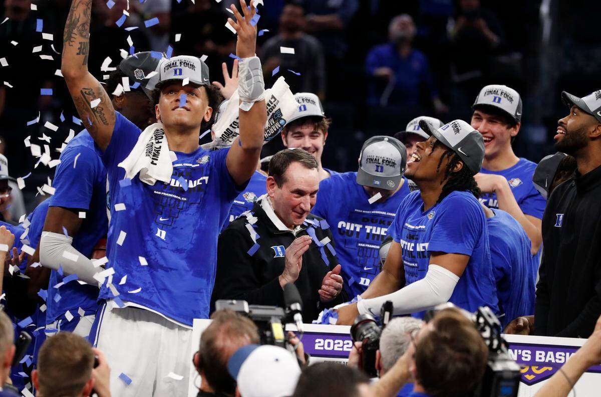 Duke head coach Mike Krzyzewski and the team celebrate after Duke’s 78-69 victory over Arkansas in the NCAA Tournament West Regional finals at the Chase Center in San Francisco, Calif., Saturday, March 26, 2022.