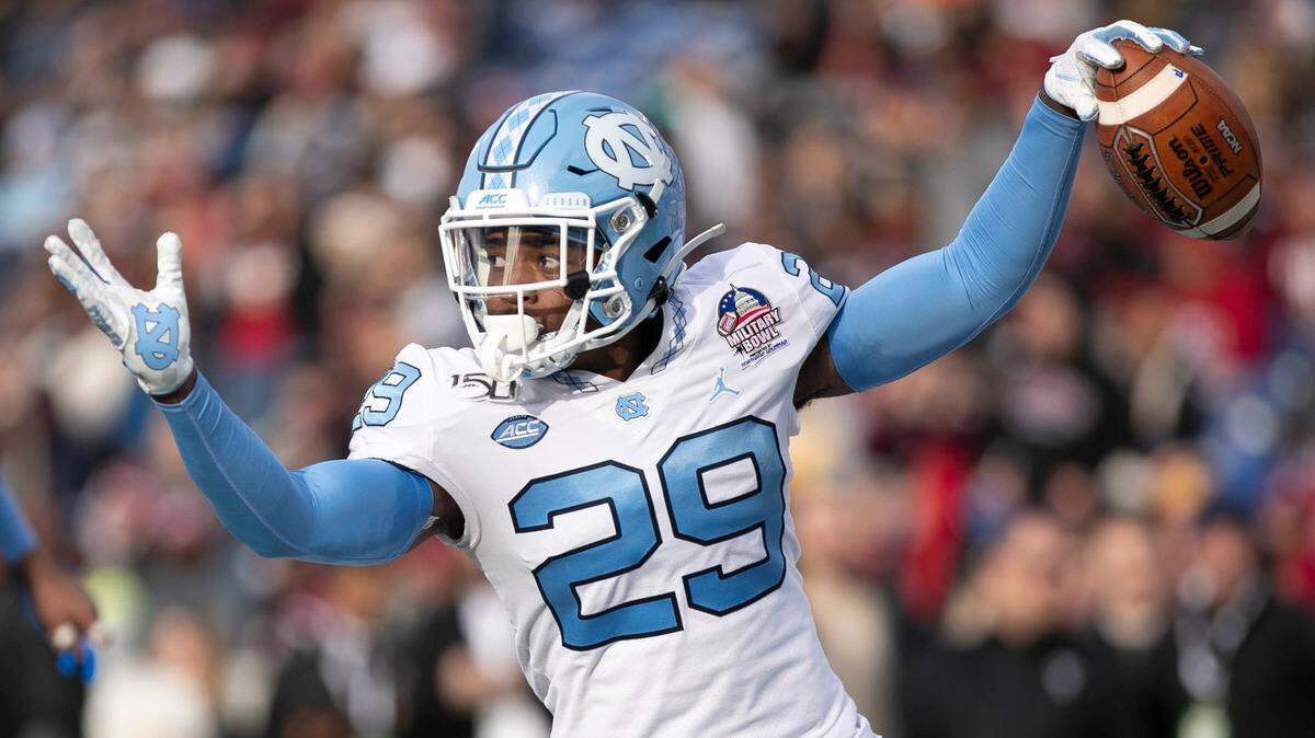 North Carolina’s Storm Duck returns an interception of Temple quarterback Anthony Russo 20 yards for a touchdown to give the Tar Heels’ a 34-6 lead in the third quarter during the Military Bowl on Friday, Dec. 27, 2019 at Navy-Marine Corps Memorial Stadium in Annapolis, Maryland.