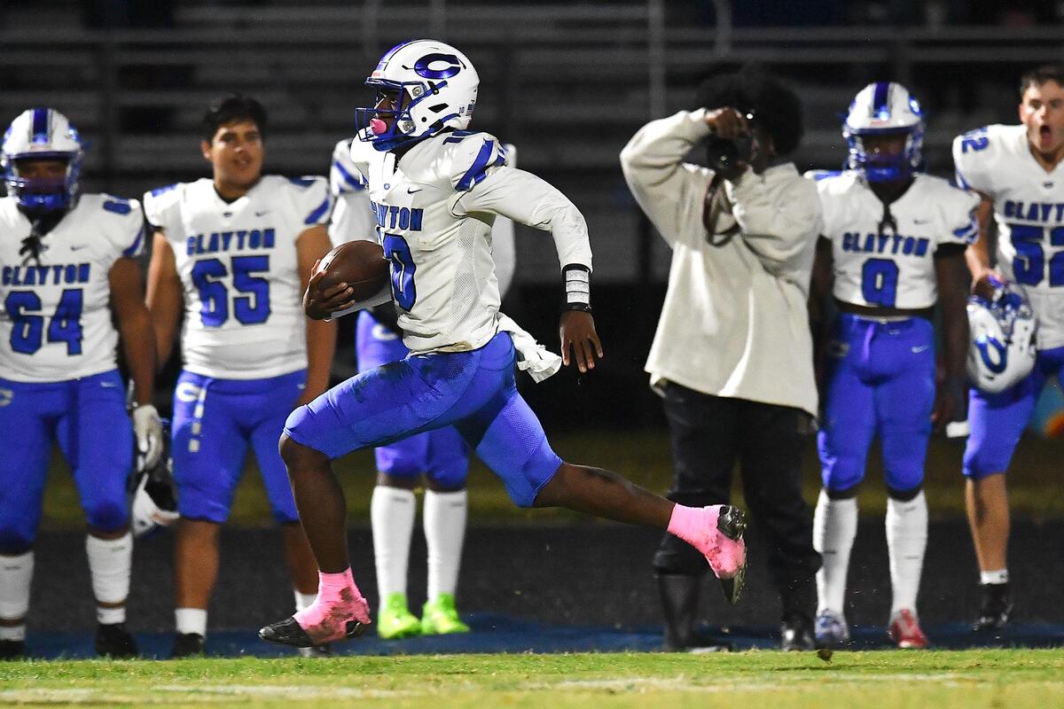 Clayton quarterback Johnathan Montague (10) runs for long yardage against Willow Spring during the first half. The Clayton Comets and the Willow Spring Storm met in a conference football game in Fuquay-Varina, N.C. on October 20, 2023.