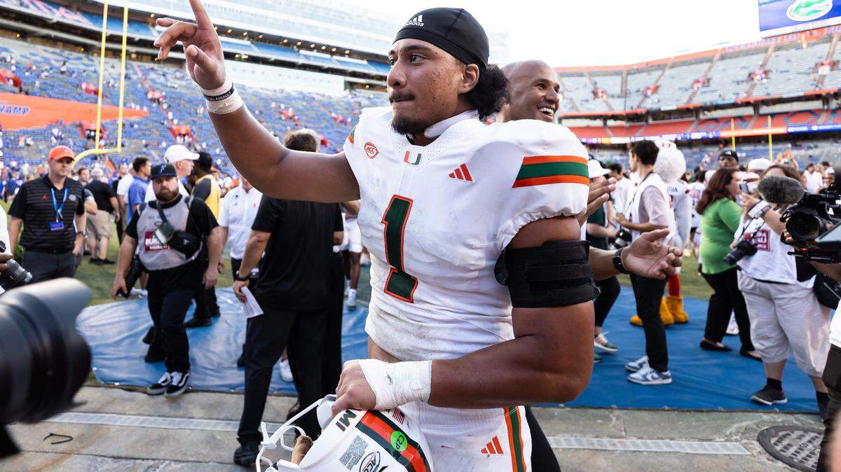 Aug 31, 2024; Gainesville, Florida, USA; Miami Hurricanes quarterback Cam Ward (1) reacts after a game against the Florida Gators at Ben Hill Griffin Stadium.