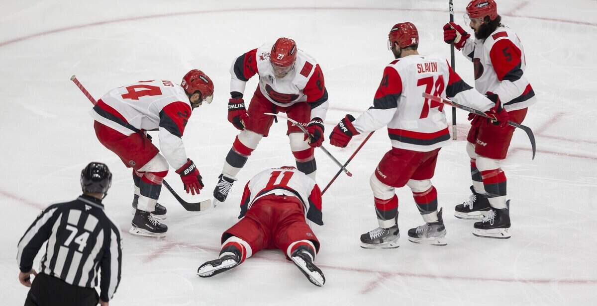 Carolina Hurricanes players Seth Jarvis (24), Nikolaj Ehlers  (27), Jacoob Slavin (74) and Jalen Chatfield (5) surround center Jordan Staal (11) after he scored to take 4-3 lead over Vegas in the third period of Game 4 of the Stanley Cup Final, on Tuesday, June 9, 2026 in Las Vegas, NV.