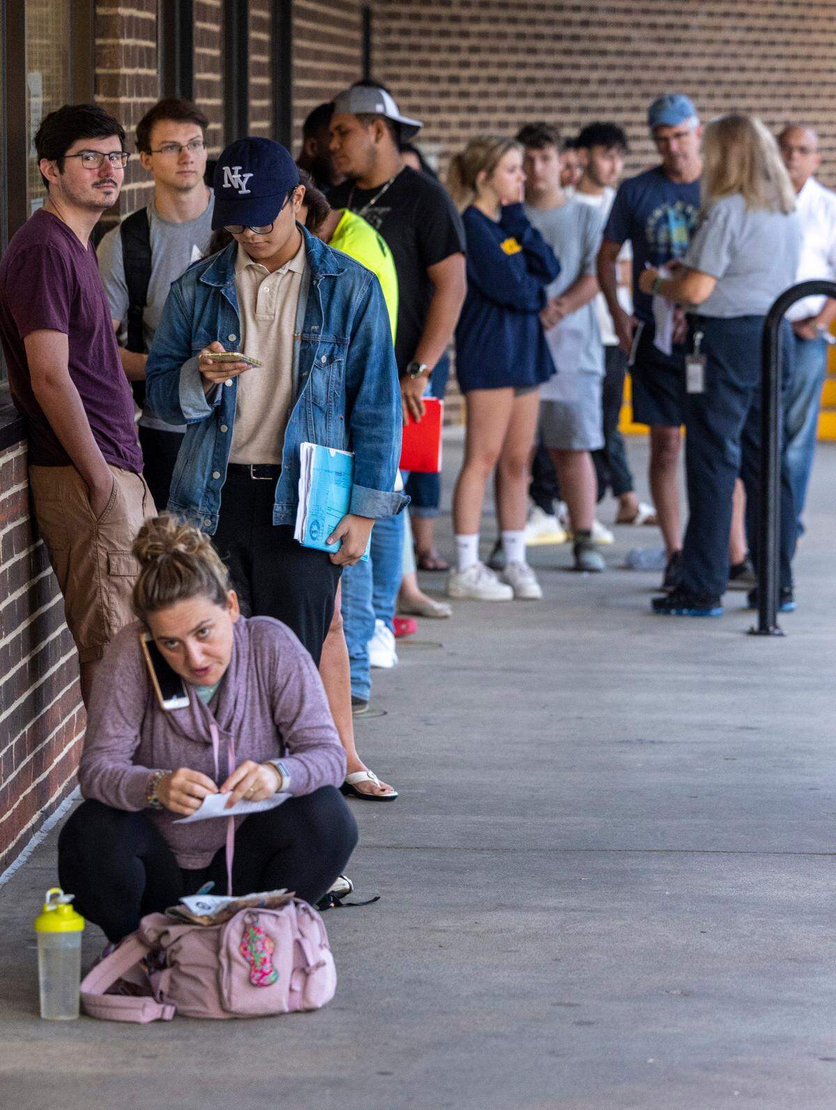 A line forms outside the Department of NC Motor Vehicles’ West Raleigh Driver License Office Friday morning, Sept. 2, 2022.