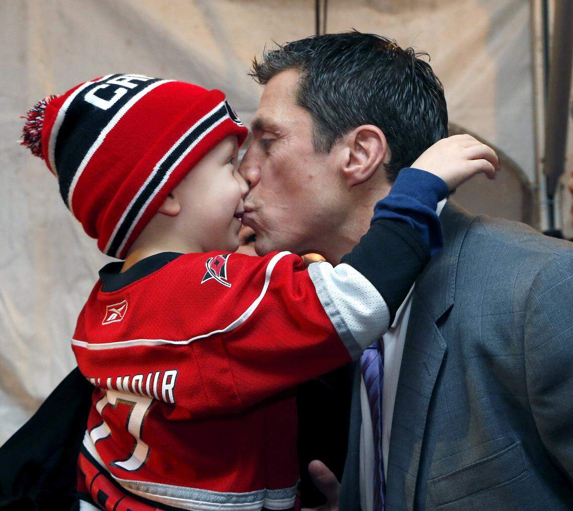 Rod Brind'Amour, right, gets a kiss from his son Brooks Brind'Amour during a red carpet reception held before an NHL game played between the Carolina Hurricanes and the Pittsburgh Penguins at the PNC Arena in 2016 celebrating the 10th anniversary of the Stanley Cup championship.