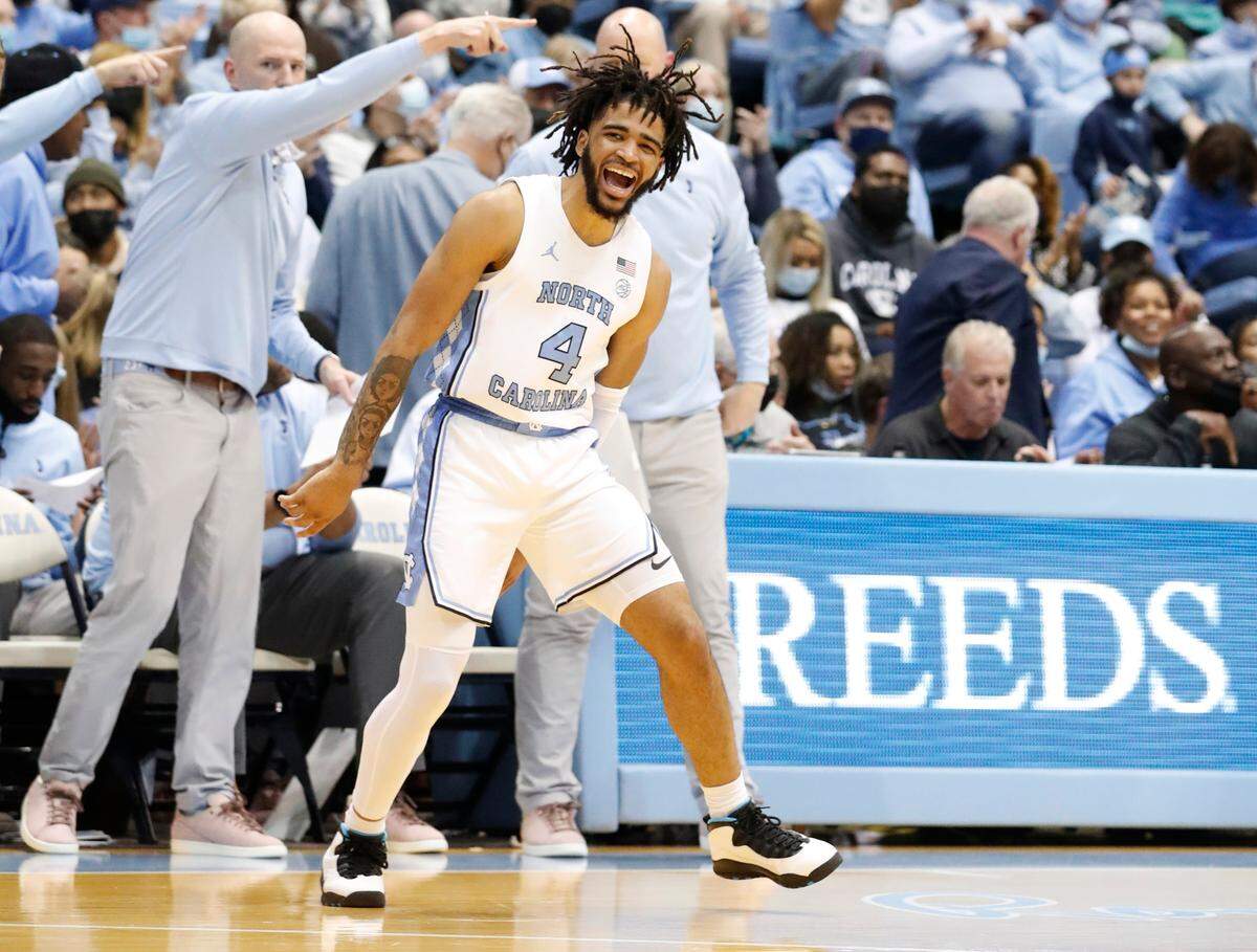 North Carolina’s RJ Davis (4) celebrates after hitting a three-pointer during UNC’s 100-80 victory over N.C. State at the Smith Center in Chapel Hill, N.C., Saturday, Jan. 29, 2022.