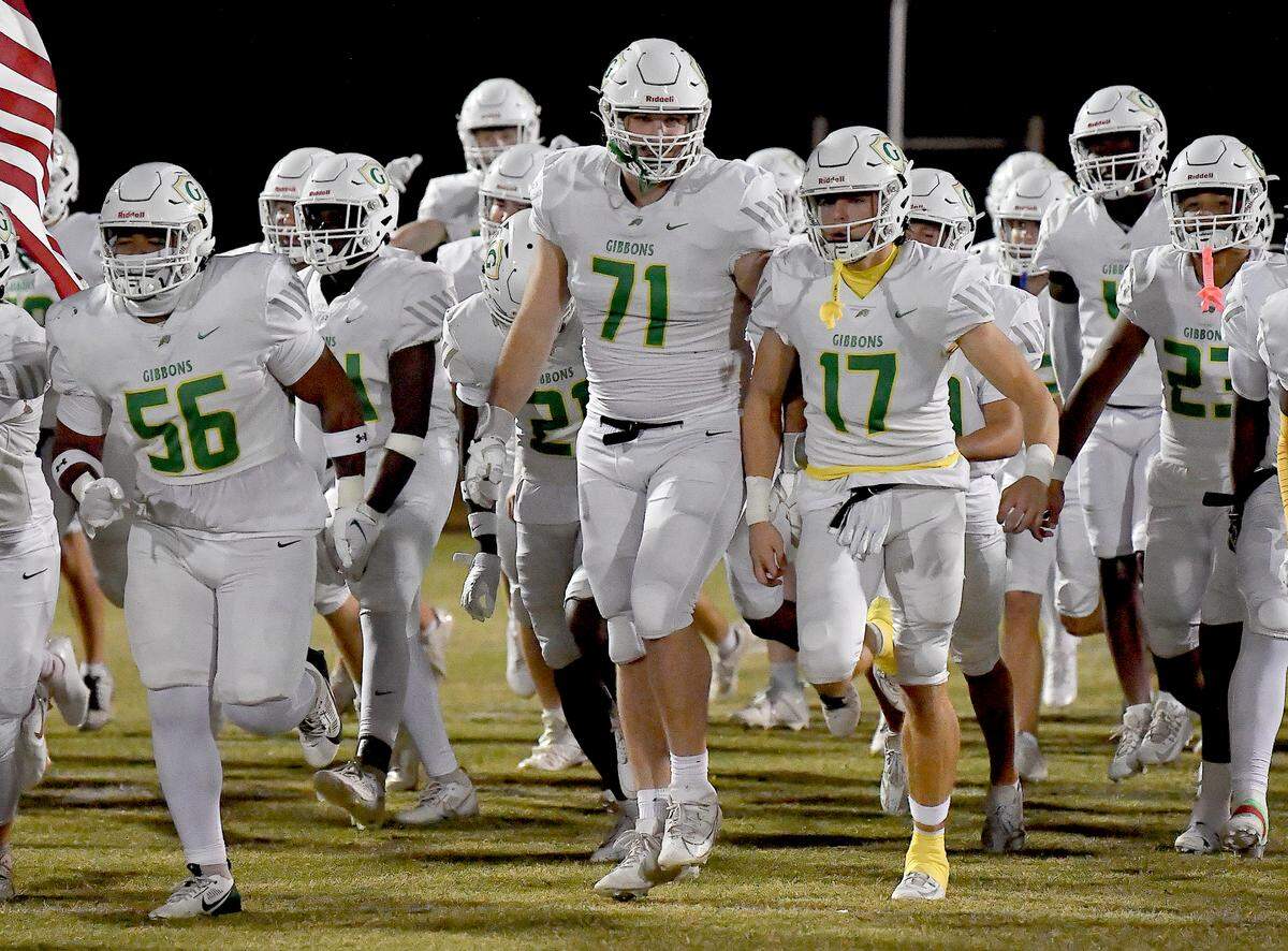 Cardinal Gibbons’ Jack Sheehan (71) and the team take to the field before their game with Leesville Road. The Leesville Road Pride and the Cardinal Gibbons Crusaders met in a conference football game in Raleigh, N.C. on November 1, 2024.