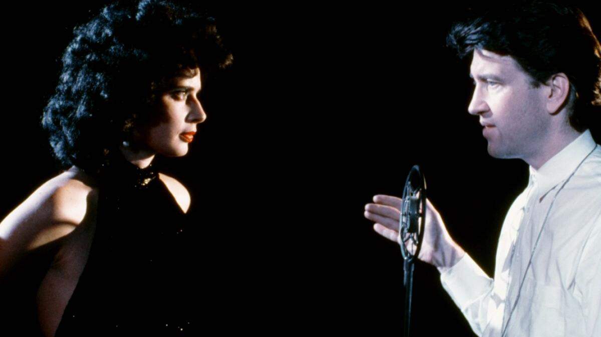 Isabella Rossellini, left, plays a masochistic nightclub singer in ‘Blue Velvet,’ directed by David Lynch, right. The 1986 movie was filmed in North Carolina.