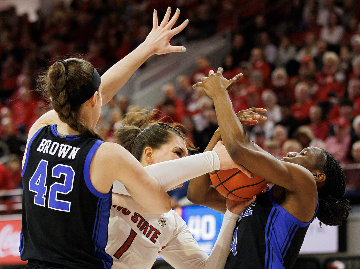 Duke’s Kennedy Brown and Jadyn Donovan pressure N.C. State’s River Baldwin during the second half of the Wolfpack’s 72-57 win on Sunday, Jan. 21, 2024, at Reynolds Coliseum in Raleigh, N.C.