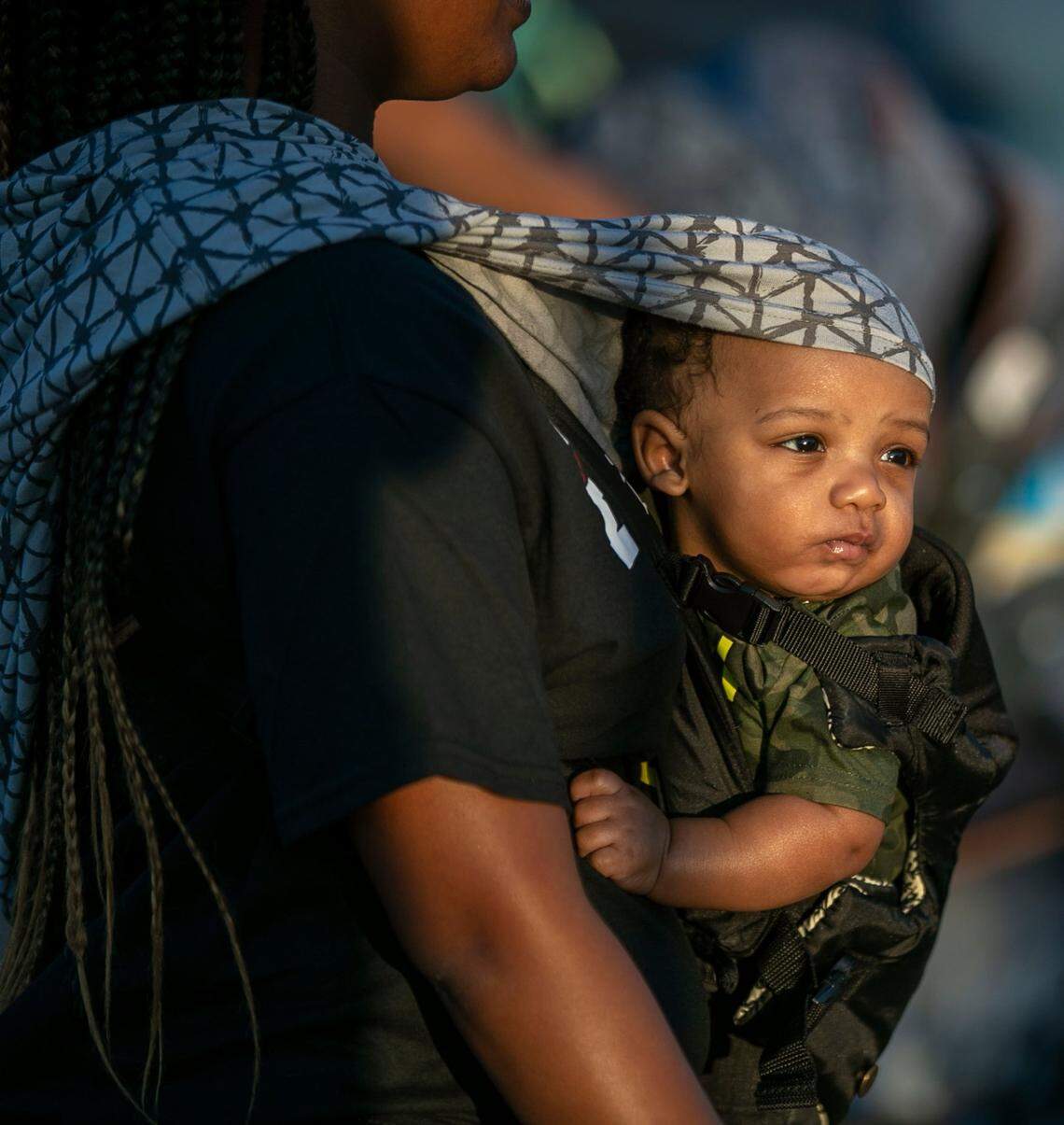 Four-month-old Landon Bell and his mother Kalayzia Bell march with demonstrators calling for justice in the Andrew Brown Jr. case on Friday, May 21, 2021 in Elizabeth City, N.C. Demonstrators have marched for more than 30 days following the death of Andrew Brown Jr. at the hands of Pasquotank County deputies who were serving an arrest warrant last month.