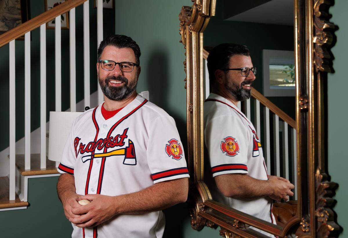 Chris Buccafusco, photographed in Durham on Wednesday, April 16, 2025, and his brother want to change the Atlanta Braves name to “Bravest” to respect Native Americans. The siblings created the fan club “Bravest ATL,” with an ax symbol that could represent first-responders.