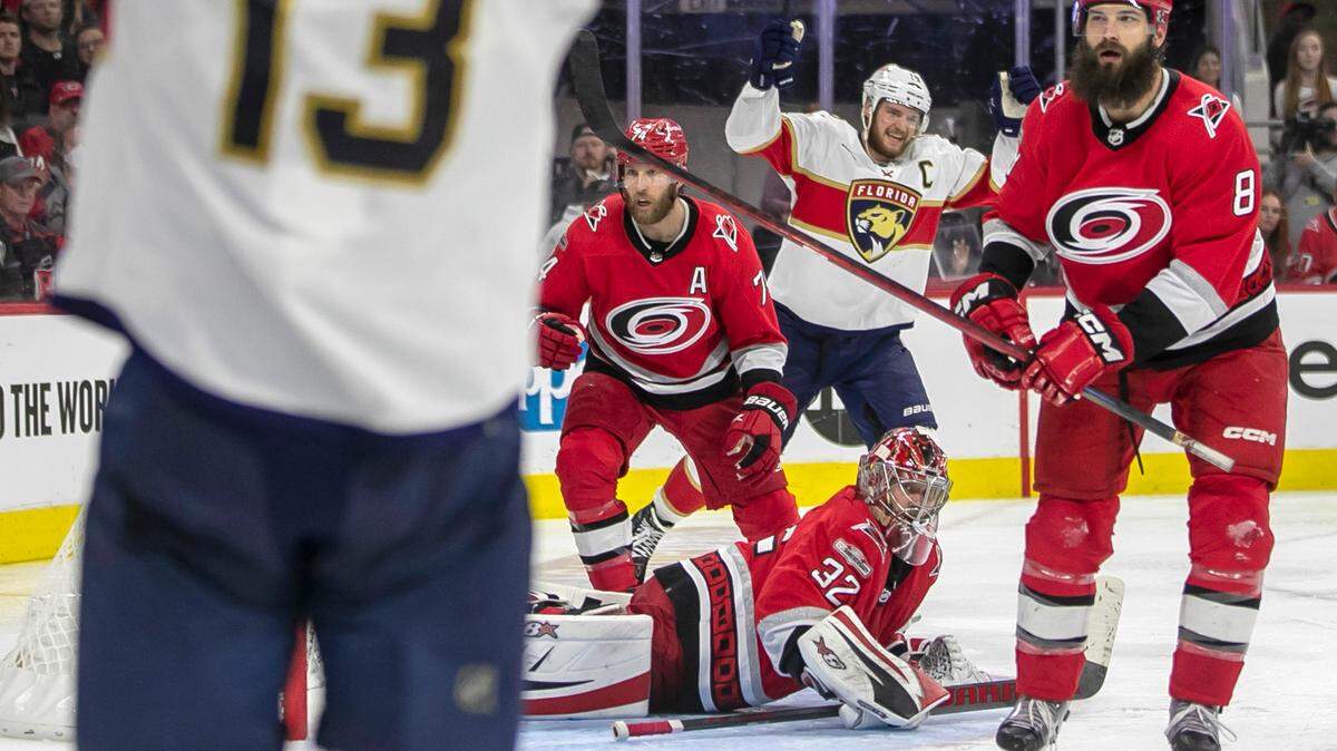 Florida Panthers captain Aleksander Barkov (16) reacts after the game winning goal in overtime by Matthew Tkachuk (19) on Carolina Hurricanes goalie Antii Raanta (32) during Game 2 of the Eastern Conference Finals on Saturday, May 20, 2023 at PNC Arena in Raleigh, N.C.