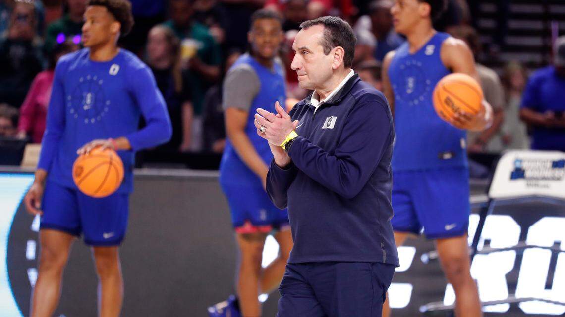 Duke head coach Mike Krzyzewski encourages his team during the Blue Devils’ open practice at the Bon Secours Wellness Arena in Greenville, S.C., Thursday, March 17, 2022.