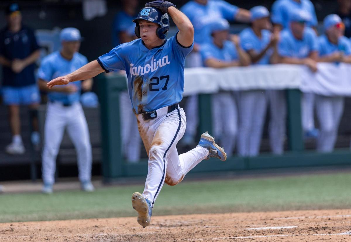 North Carolina center fielder Kane Kepley (27) scores on a double by catcher Luke Stevenson (44) to take a 3-2 lead over Arizona in the fourth inning during the NCAA Super Regional on Saturday, June 7, 2025 at Boshamer Stadium in Chapel Hill, N.C.